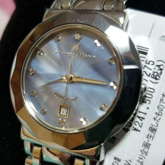 An elegant quartz wristwatch with a mother-of-pearl dial and stone indic #QY7IUQ