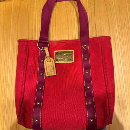 A4 size LOUIS VUITTON Antigua handbag, leather and canvas. #QYEUSJ