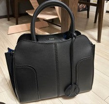 TOD'S SELLA handbag, black, with ball-shaped charm. #QYDQON