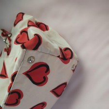PRADA heart-patterned handbag with ribbon and shoulder strap. #QY4BCC