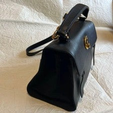 Pre-Owned only once. Saint Laurent black leather handbag with gold hardware. #QY38J0