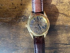 Hand-wound skeleton wristwatch, brown leather strap. #QY0GBX