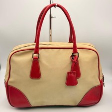 Prada canvas handbag with red leather trim, Boston bag in beige. #QY6H8A