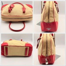 Prada canvas handbag with red leather trim, Boston bag in beige. #QY6H8A