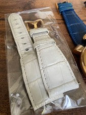 GaGa Milano hand-wound watch with blue leather strap, gold accents, and #QYFNSI