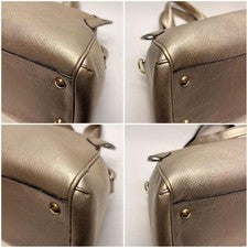 Cartier Marcello handbag, gold and bronze. #QYC0HK