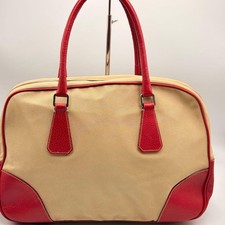 Prada canvas handbag with red leather trim, Boston bag in beige. #QY6H8A