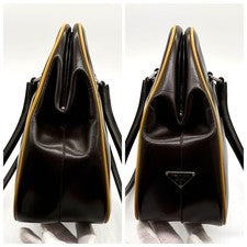 Prada handbag, leather, clasp closure, triangular logo, white tag, brown #QYF0FX