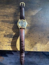 Hand-wound skeleton wristwatch, brown leather strap. #QY0GBX