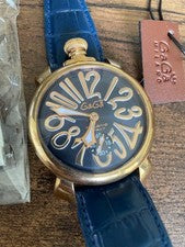 GaGa Milano hand-wound watch with blue leather strap, gold accents, and #QYFNSI