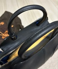 TOD'S SELLA handbag, black, with ball-shaped charm. #QYDQON